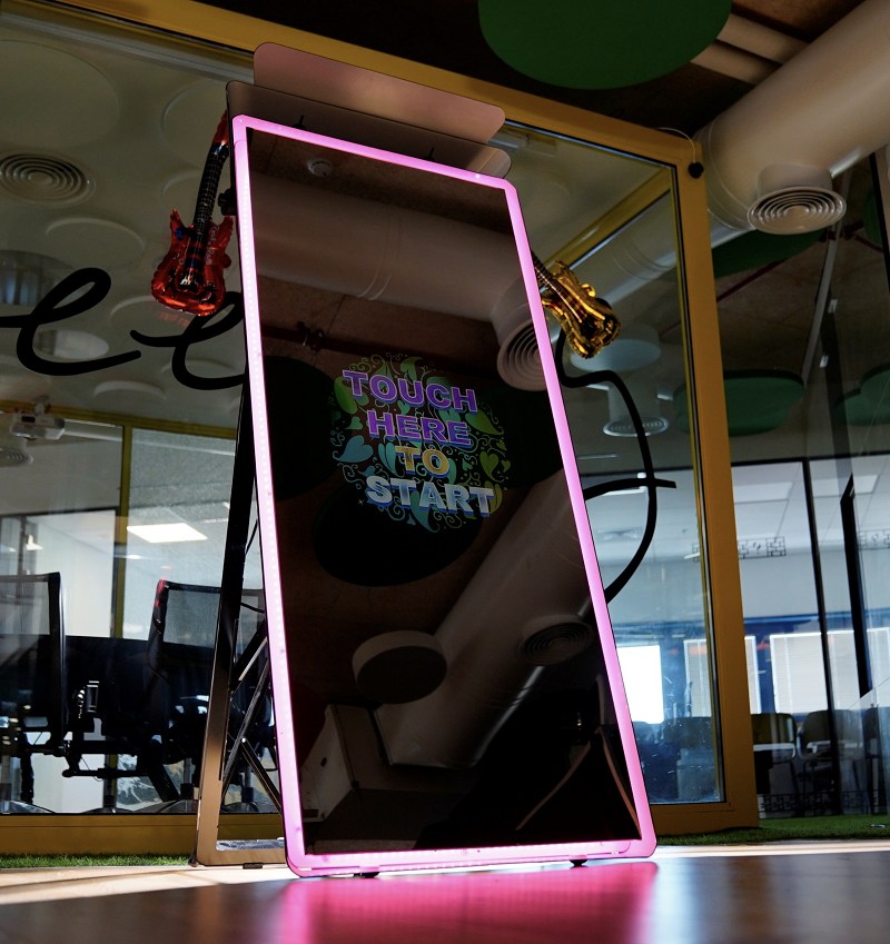 Magic mirror photo booth rental with interactive touchscreen display